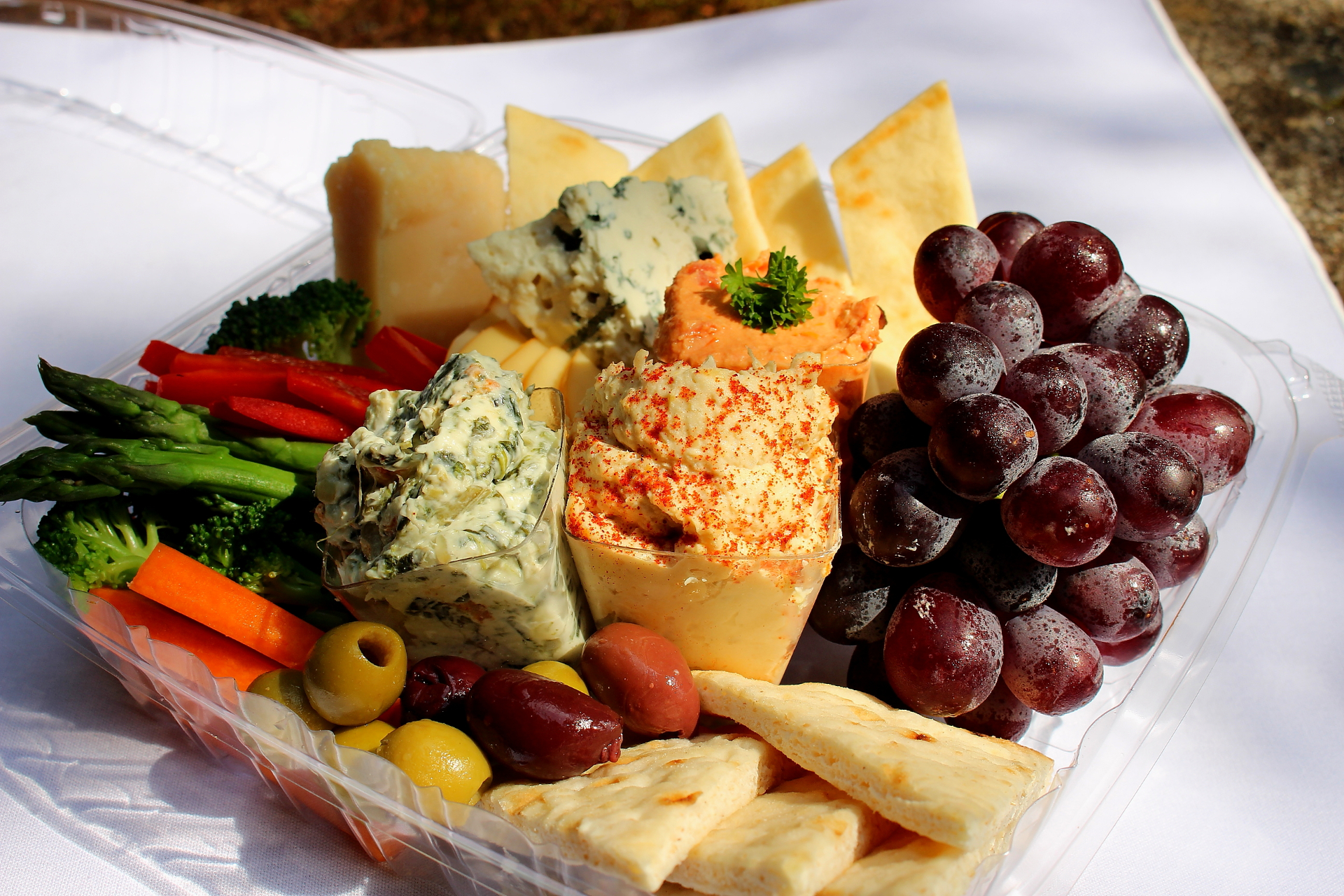Artisan cheese and crudité platter with grapes and olives